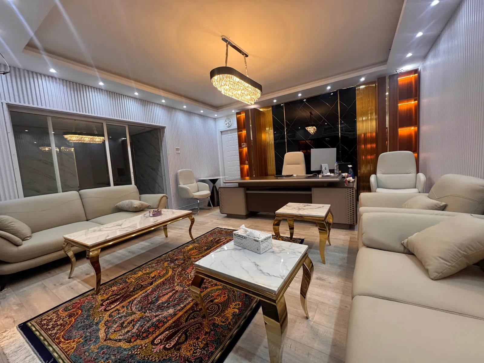 MDS executive office with marble tables and chandelier